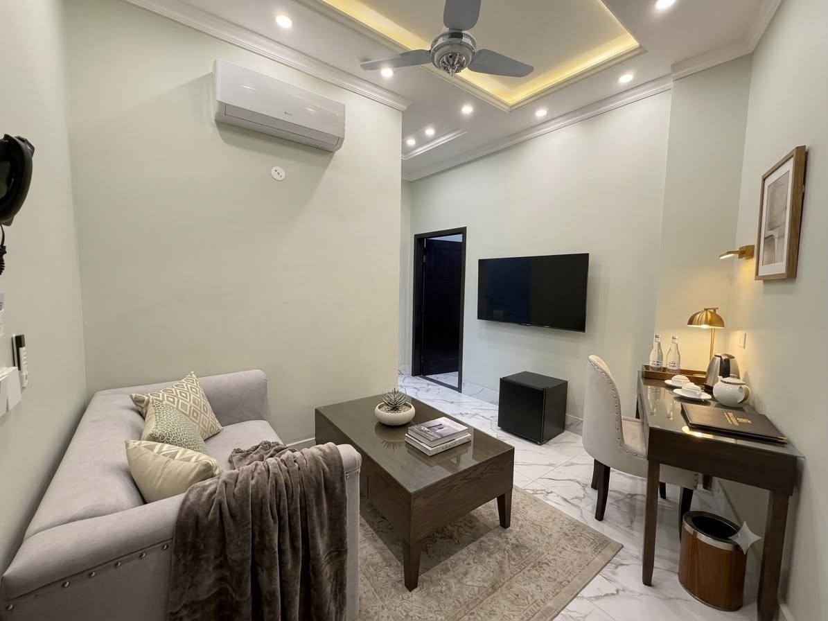 Junior Suite living room seating at Regency Suites Hotel, 48 Baloch Road, Gulberg III, Lahore
