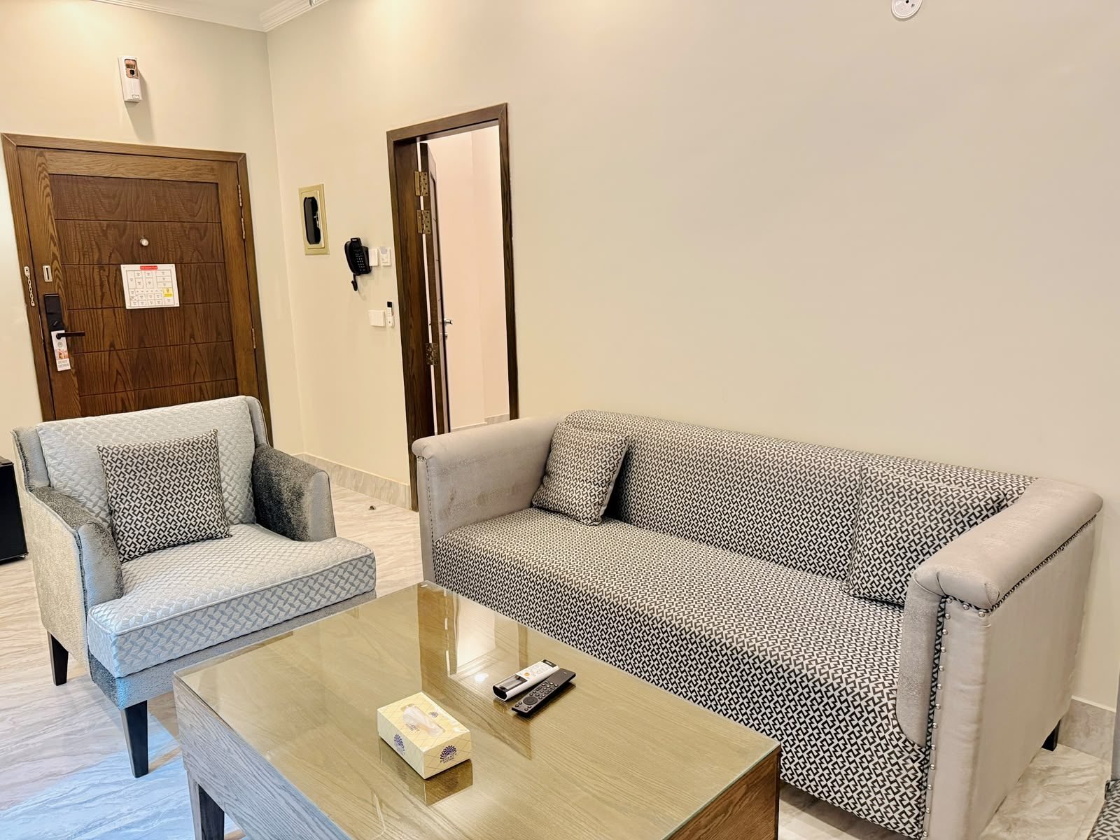 Junior Suite living room with entrance at Regency Suites Hotel, 48 Baloch Road, Gulberg III, Lahore