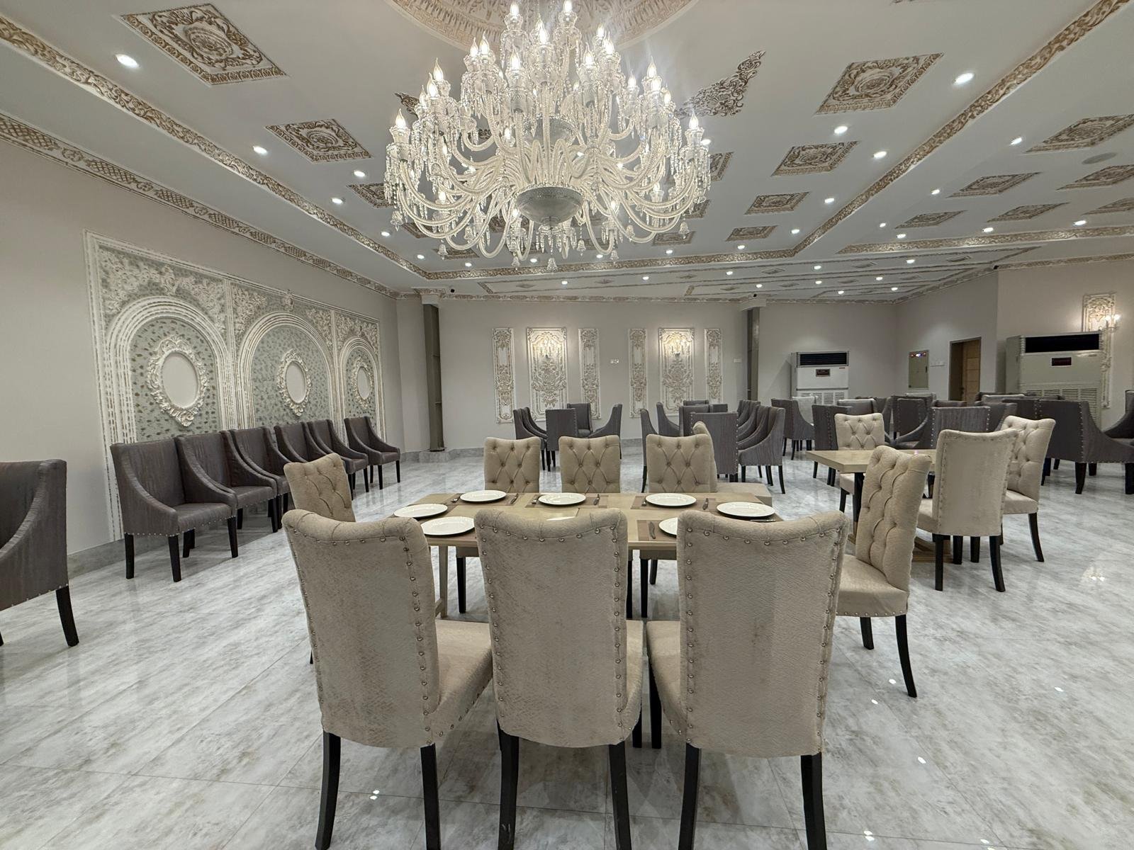 Long family table set for guests at Darbar Rooftop, Gulberg III