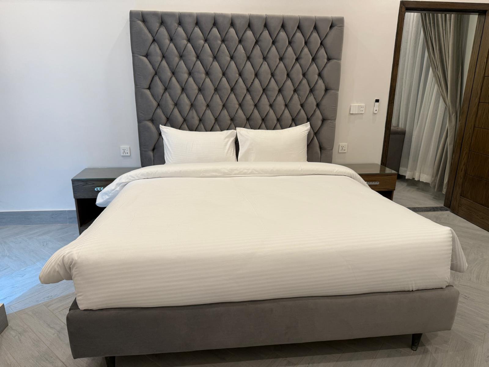 Suite bedroom with king bed at Regency Suites, Gulberg III Lahore
